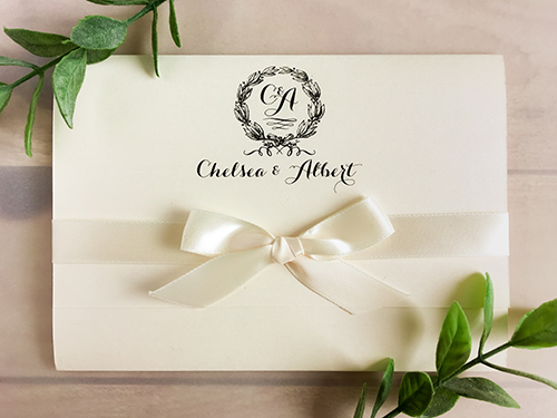 Invitation 1694: Ivory Pearl, Ivory Pearl, Antique Ribbon - This is an ivory pearl wedding invite with a full flap pocket folder.  There is a 5/8 antique bow around the flap.