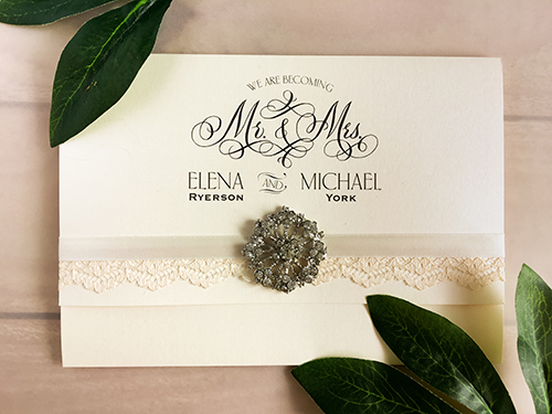 Invitation 1701: Ivory Pearl, Ivory Pearl, Antique Ribbon, Cream - Thin Lace, Brooch/Buckle A19 - This is a 3/4 flap ivory pearl pocketfolder wedding invitation with a ribbon, lace and brooch detail around the flap.