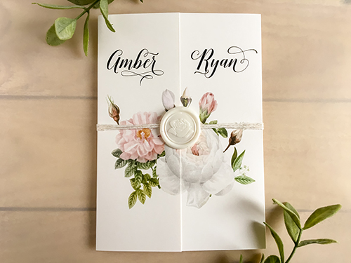 Invitation 2218: This gate fold wedding invitation is a very popular style this year. Florals are printed on the cover and a white string is wrapped around the card and finished with an ivory wax seal.