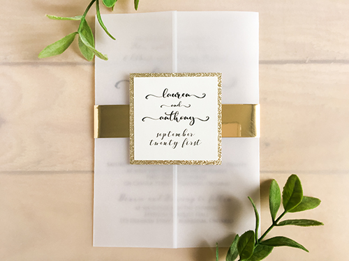 Invitation 2236: Champagne Glitter, Cream Smooth - This is a vellum gate wedding invite design.  There is a thin gold mirror belly band with a champagne glitter layered cover tag.