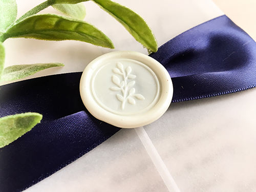 Invitation 2266: Ivory Wax, Navy Ribbon - This is a vellum gate fold wedding invite.  The text is printed directly on the vellum.  There is a navy ribbon and ivory branch wax seal.