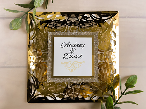 Invitation lc122: Mirror Gold, Gold Mirror, Cream Smooth - This is a four flap gold mirror laser cut wedding invite.  There is a double layered cover tag in champagne glitter and gold mirror.