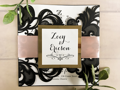 Invitation lc69: Glittering Black, Gold Mirror, Cream Smooth, Deep Blush Ribbon - This is a glittering black gate fold laser cut wedding invite with a deep blush ribbon and gold mirror backing on the cover.