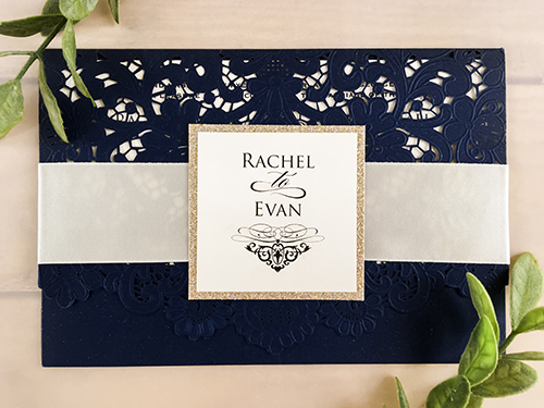 Invitation lc83: Glittering Navy, Cream Smooth, Antique Ribbon - This is a glittering navy pocket style laser cut wedding invitation.  There is a flat antique ribbon with champagne glitter layered cover tag.