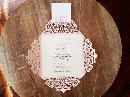Invitation mb24: Blush Shimmer, Rose Gold Mirror, Cream Smooth, Brooch/Buckle X, Metal Filigree F4 - Silver - This is a square shaped four flap laser cut invite in blush shimmer.  There is a layered cover tag and combo brooch glued to the cover tag.