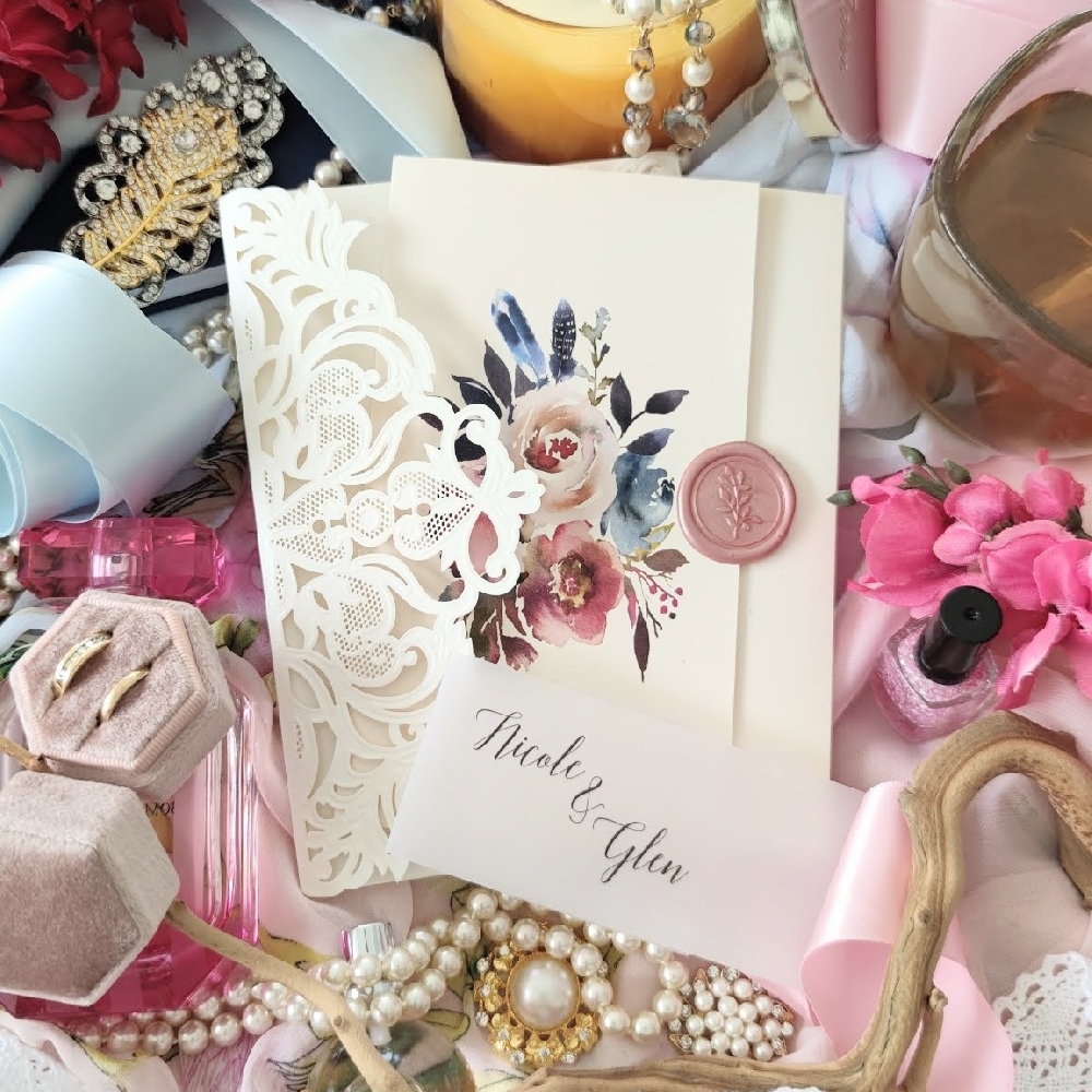 Florals, lasercuts and a wax seal put together creates a beautiful invitation ensemble. At Stephita we offer a large selection and the best prices for lasercut invitations.
