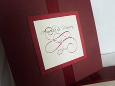 Invitation 921: Burgundy Linen, Red Lacquer, Cream Smooth, Scriptina, Lucida Calligraphy, Sherry Ribbon, Brooch/Buckle Rhinestone