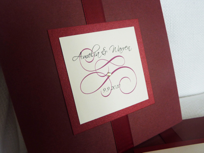 Invitation 921: Burgundy Linen, Red Lacquer, Cream Smooth, Scriptina, Lucida Calligraphy, Sherry Ribbon, Brooch/Buckle Rhinestone