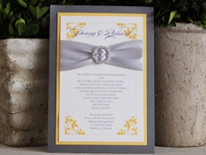 Invitation 922: Charcoal Pearl, Mango Pearl, Cream Smooth, Burgues Script, Myriad Pro Light, Silver Ribbon, Brooch/Buckle L