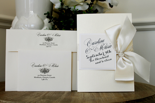 Invitation 1514: The feature of this invite is the beautiful large bow tied to the side.  The invite opens and there is a pocket on the left side, and the invitation wording on the right.