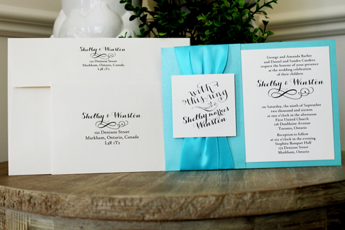 Invitation 1516: Tiffany Pearl, Cream Smooth, Turquoise Ribbon, Turquoise Ribbon - This invite is layered with two thick ribbons along the side and a tag over the ribbons.