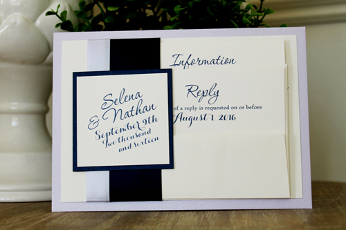 Invitation 1525: This soft layered invite uses our 5/8 and 1.5 inch ribbon as a flat band around the invite card.  The ribbon and tag are affixed to the card and do not slide off.