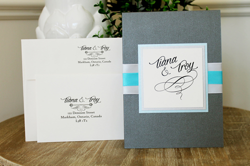 Invitation 1545: This invite card has a large cover tag that has three layers, using light blue and silver paper.  The ribbon is also a matching light silver thick ribbon with a turquoise ribbon on top.