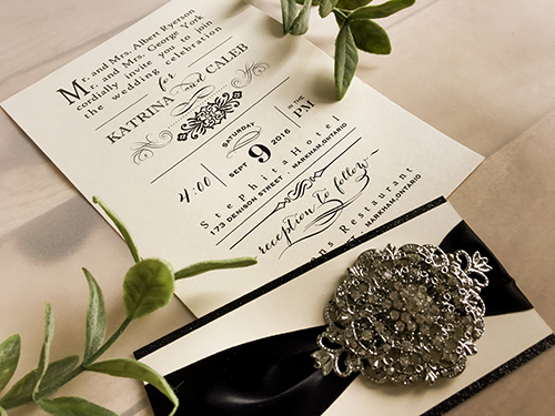 Invitation 1639: Ivory Pearl, Ivory Pearl, Black Ribbon, Brooch/Buckle X, Metal Filigree F4 - Silver - This is a single card invite on ivory pearl paper with a layered belly band, ribbon and brooch design.