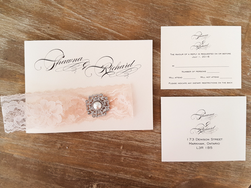 Invitation 1724: White Gold, White Gold, Cream Lace, Brooch/Buckle Q - This is a full flap white gold pearl wedding invitation pocket fold design.  There is a lace trim and brooch on the flap.