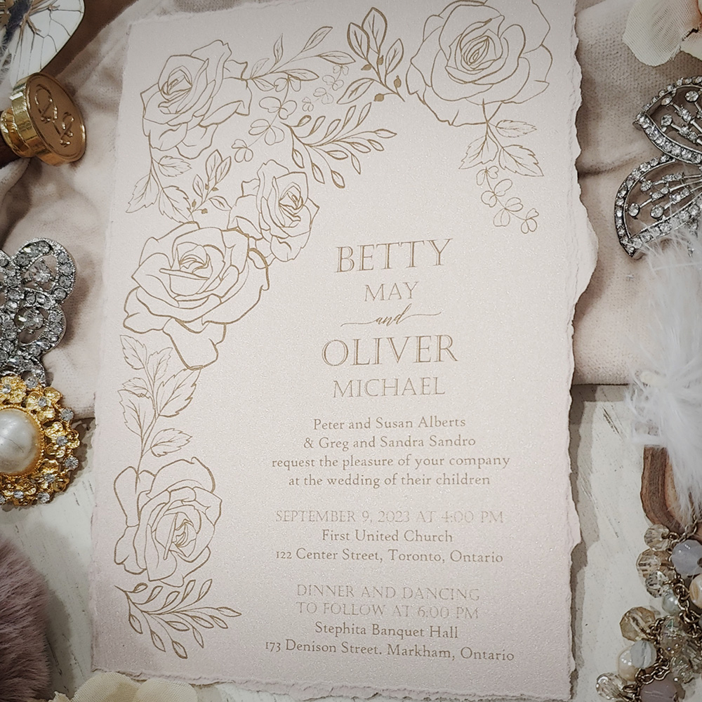 Invitation 2840: Blush Pearl - Deckled edge wedding card printed on a blush pearl paper with a gold floral design.