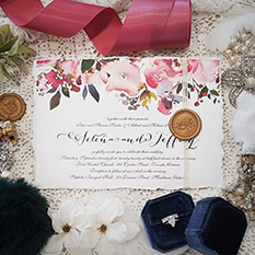 Invitation 3802: Ice Pearl, Gold Wax, String Ribbon - Torn edge wedding card on white paper with a floral print.  There is string and gold wax seal.