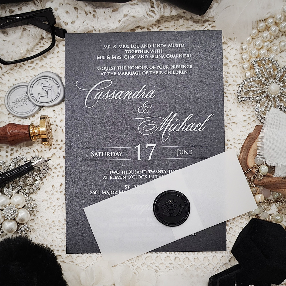 Invitation 3701: Black Pearl, Black Wax - White ink printing on black paper with a vellum belly band and black wax seal.