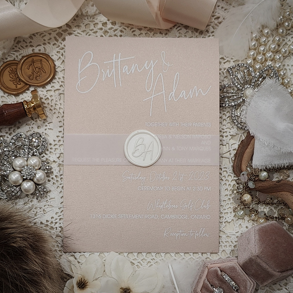 Invitation 3707: Blush Pearl, Ivory Wax - White ink printing on blush pearl paper with a vellum belly band and ivory custom wax seal.