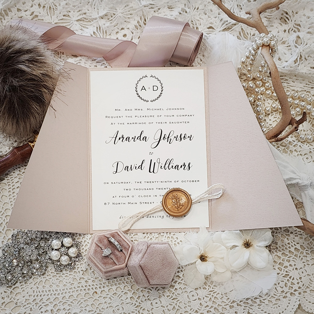 Invitation 3320: Blush Pearl, Cream Smooth, Gold Wax, String Ribbon - Slanted cut gate fold wedding invitation with a string and gold branch wax seal.