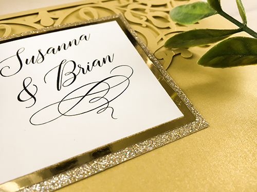 Invitation lc104: Metallic Gold, Gold Mirror, Cream Smooth - This is metallic gold laser cut pocket fold wedding invitation with a double layered cover tag.