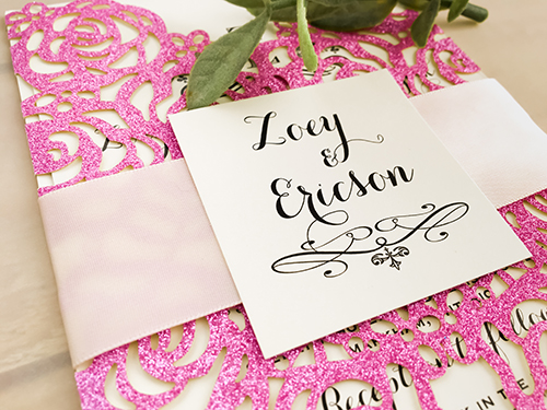 Invitation lc106: Glitter Hot Pink, Cream Smooth, Petal Pink Ribbon - This is a hot pink glitter gate fold laser cut wedding invite.  The gate pattern is like a rose pattern.  There is a ribbon stripe and cover tag.