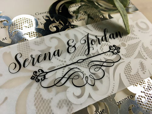 Invitation lc108: Mirror Silver, Cream Smooth - This is a silver mirror gate fold style laser cut wedding invitation.  There is also a vellum printed belly band.