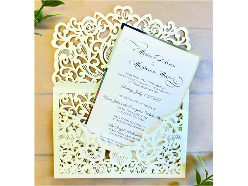 Invitation lc154: Ivory Shimmer, Silver Mirror, Cream Smooth - This is an ivory shimmer laser cut invitation with a very intricate design patter on the flap.  The main layout has a silver mirror backing.