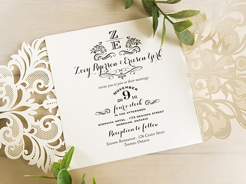 Invitation lc24: Ivory Shimmer, Cream Smooth, Brooch/Buckle A6 - This is a damask pattern gate fold laser cut wedding invite in the ivory shimmer paper.  There is a pearl and rhinestone brooch on the flap.