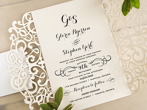 Invitation lc26: Ivory Shimmer, Champagne Glitter, Cream Smooth - This is an ivory shimmer gate fold laser cut wedding card.  The cover tag has a champagne glitter paper backing.