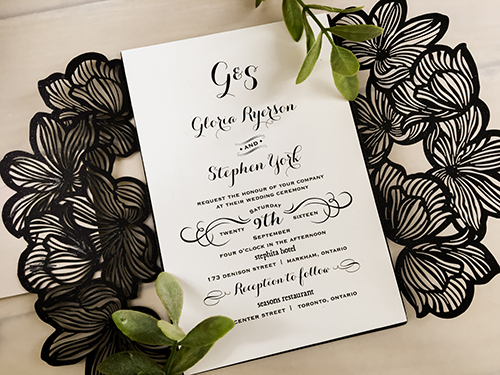 Invitation lc29: Glittering Black, Blush Pearl, Cream Smooth - This is a glittering black laser cut wedding card.  The gate flaps looks like florals. There is a blush pearl layered cover tag.