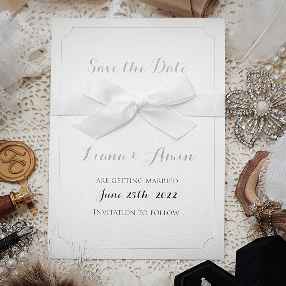 Invitation 8304:  - traditional save the date on cream matte paper with bow