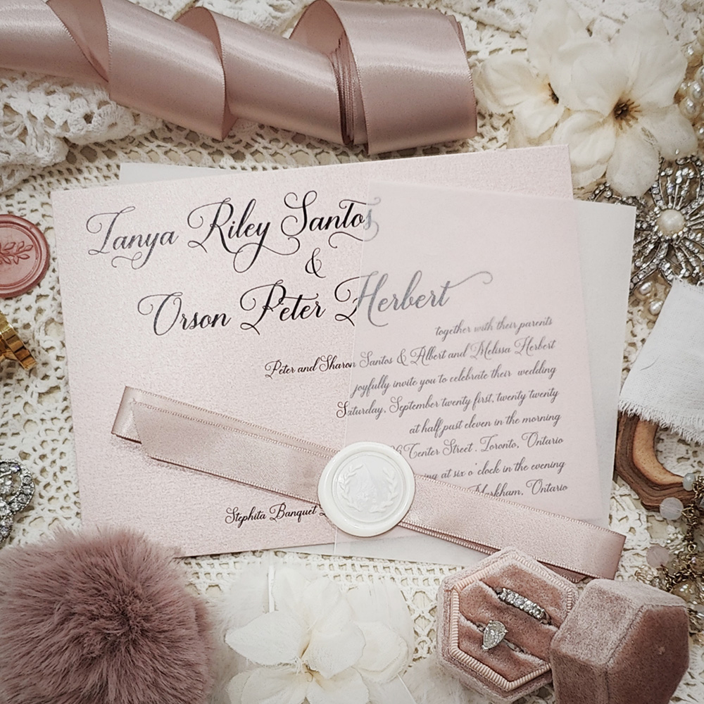 Invitation 3207: Blush Pearl, Ivory Wax, Blush Ribbon - Landscape single card with a clear vellum wrap and blush ribbon and ivory wax seal.