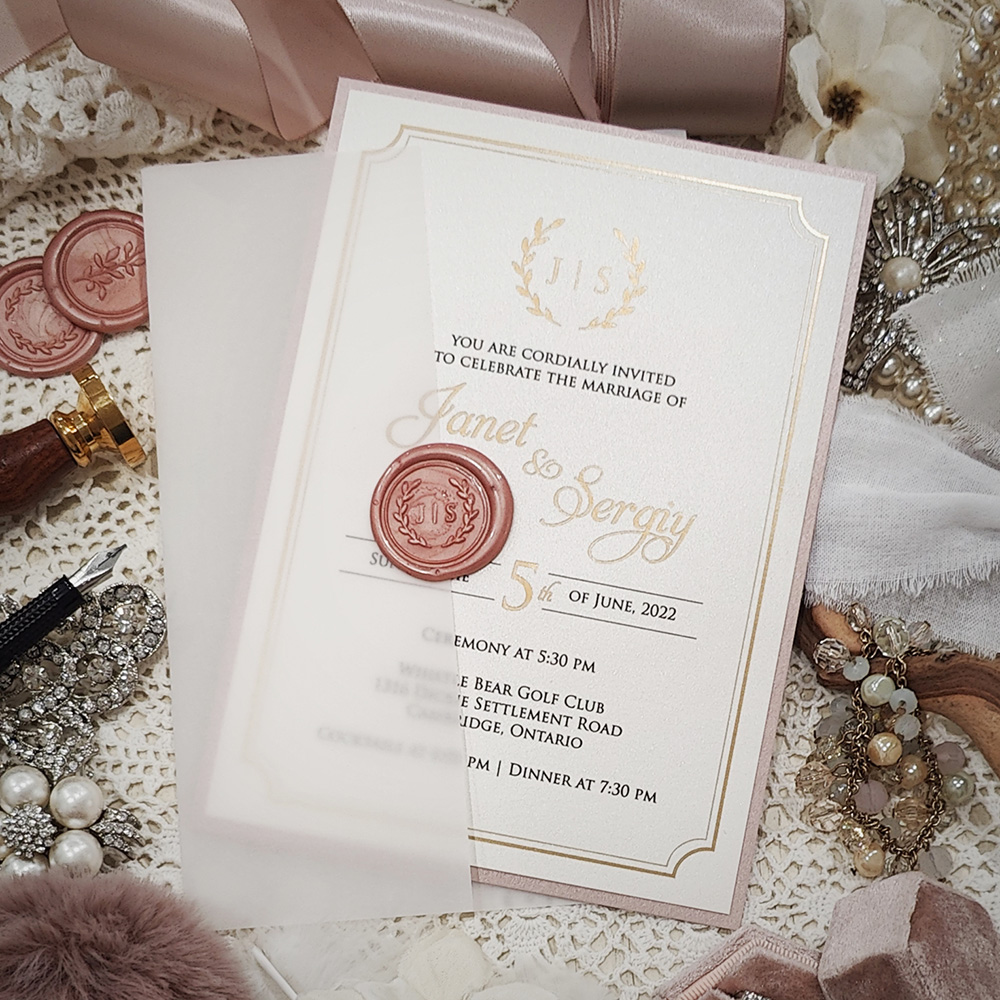 Invitation 3226: Ivory Pearl, Blush Pearl, Blush Wax - This is a layered invite with a blush pearl backing.  It is wrapped with a clear vellum wrap and blush wreath wax seal.