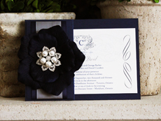 Invitation 724: Navy Pearl, Cream Smooth, Origins, High Tower, Black Ribbon, Charcoal Ribbon, Brooch/Buckle T