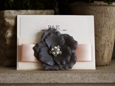 Invitation 725: Ivory Pearl, Ivory Pearl, Cream Smooth, Devon, High Tower, Blush Ribbon, Blush Ribbon, Brooch/Buckle A21, Flower Color Charcoal