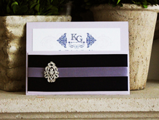 Invitation 728: Orchid Pearl, Orchid Pearl, Cream Smooth, Beau Rivage, High Tower, Navy Ribbon, Lilac Ribbon, Brooch/Buckle A17