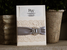 Invitation 730: Ivory Pearl, Cream Smooth, English Presto, High Tower, Silver Ribbon, Cream Lace, Brooch/Buckle R