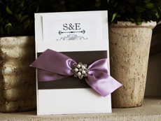 Invitation 733: Antique Pearl, Antique Pearl, White Smooth, Burgues Script, High Tower, Charcoal Ribbon, Charcoal Ribbon, Lavender Ribbon, Brooch/Buckle A3