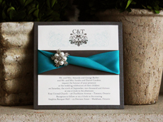 Invitation 747: Charcoal Pearl, Cream Smooth, High Tower, Charcoal Ribbon, Peacock Ribbon, Brooch/Buckle A21