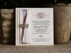 Invitation 754: Ivory Pearl, Cream Smooth, CAC Shishoni, High Tower, Blush Ribbon, Silver Ribbon, Brooch/Buckle A12