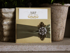 Invitation 785: Gold Dust, Gold Dust, Cream Smooth, Beau Rivage, High Tower, Light Sage Ribbon, Light Sage Ribbon, Brooch/Buckle A19, Metal Filigree F4 - Bronze