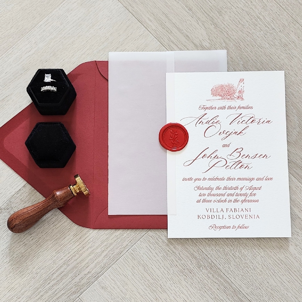This is a luxurious letterpress wedding invitation using red ink on a white cotton thick paper.   There is also a full vellum wrap enclosure with a red branch wax seal as an embellishment.  This set of wedding card goes into a red envelope.

The design layout has a drawing of the venue that the couple is getting married in Slovenia.  Villa Fabiani is a historic villa and estate located in Komen, in Slovenia’s Karst region. It’s one of the most famous cultural landmarks in the area, both for its architecture and for its deep ties to Slovenian history.