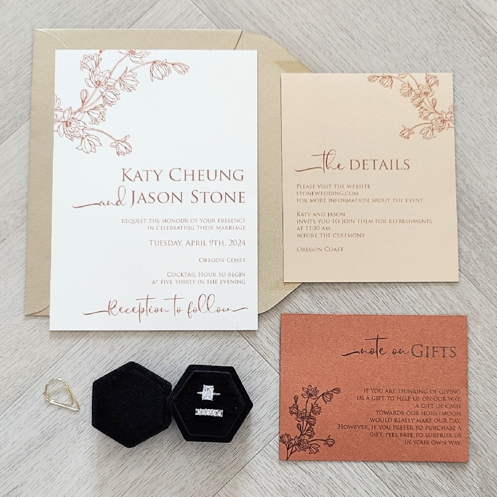 This is a set of single card wedding invitation with multiple inserts in different paper colors.  There is also a cherry blossom graphic printed on each insert for a cohesive look.  The main card is on a off white paper, the details insert is on a champagne gold paper, and the response card is on a copper pearl paper.
This wedding too place in the Oregon Coast.  The Oregon Coast is a stunning choice for a wedding, offering dramatic cliffs, sandy beaches, charming seaside towns, and plenty of natural beauty. Couples often choose it for its relaxed vibe and breathtaking photo backdrops. This is a set of single card wedding invitation with multiple inserts in different paper colors.  There is also a cherry blossom graphic printed on each insert for a cohesive look.  The main card is on a off white paper, the details insert is on a champagne gold paper, and the response card is on a copper pearl paper.
This wedding too place in the Oregon Coast.  The Oregon Coast is a stunning choice for a wedding, offering dramatic cliffs, sandy beaches, charming seaside towns, and plenty of natural beauty. Couples often choose it for its relaxed vibe and breathtaking photo backdrops.
