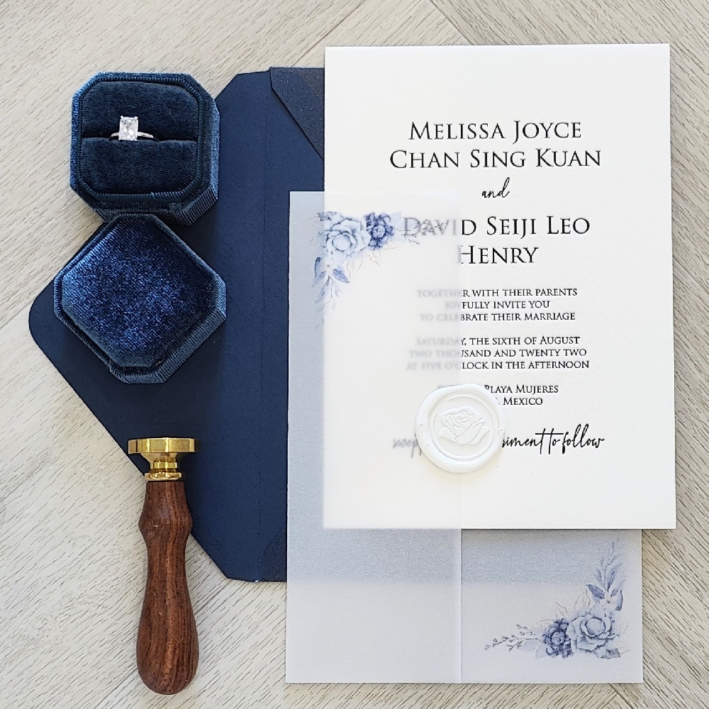This is an example of a letterpress black in printed wedding invitation on a white cotton paper stock.  There is a floral design printed on the full vellum wrap enclosure that surrounds the card.  It is embellished with a white rose wax seal.  The invitation is paired with a navy blue envelope.
This was a destination wedding invitation in Mexico!
Mexico is a breathtaking destination for weddings, offering everything from stunning beaches to historic colonial cities and luxurious resorts. Couples often choose Mexico for its year-round warm weather, vibrant culture, and diverse landscapes. Popular regions for destination weddings include Cancún and the Riviera Maya for their turquoise waters and white-sand beaches, Los Cabos for dramatic desert-meets-sea scenery, and Puerto Vallarta for lush jungles and romantic sunsets. For a more cultural and historic vibe, cities like San Miguel de Allende, Oaxaca, and Mérida showcase colorful architecture, cobblestone streets, and centuries-old churches that provide a charming backdrop.
Mexico also offers exceptional value and convenience. Many all-inclusive resorts provide turnkey wedding packages with on-site coordinators, gourmet catering, and décor inspired by local traditions. Couples can incorporate Mexican touches such as mariachi music, vibrant papel picado banners, and regional cuisine like mole or fresh seafood. Legal requirements are relatively straightforward, and many resorts assist with paperwork for civil or symbolic ceremonies. Whether you dream of a barefoot beach celebration or a grand hacienda affair, Mexico combines natural beauty, rich traditions, and warm hospitality to create an unforgettable wedding experience. This is an example of a letterpress black in printed wedding invitation on a white cotton paper stock.  There is a floral design printed on the full vellum wrap enclosure that surrounds the card.  It is embellished with a white rose wax seal.  The invitation is paired with a navy blue envelope.
This was a destination wedding invitation in Mexico!
Mexico is a breathtaking destination for weddings, offering everything from stunning beaches to historic colonial cities and luxurious resorts. Couples often choose Mexico for its year-round warm weather, vibrant culture, and diverse landscapes. Popular regions for destination weddings include Cancún and the Riviera Maya for their turquoise waters and white-sand beaches, Los Cabos for dramatic desert-meets-sea scenery, and Puerto Vallarta for lush jungles and romantic sunsets. For a more cultural and historic vibe, cities like San Miguel de Allende, Oaxaca, and Mérida showcase colorful architecture, cobblestone streets, and centuries-old churches that provide a charming backdrop.
Mexico also offers exceptional value and convenience. Many all-inclusive resorts provide turnkey wedding packages with on-site coordinators, gourmet catering, and décor inspired by local traditions. Couples can incorporate Mexican touches such as mariachi music, vibrant papel picado banners, and regional cuisine like mole or fresh seafood. Legal requirements are relatively straightforward, and many resorts assist with paperwork for civil or symbolic ceremonies. Whether you dream of a barefoot beach celebration or a grand hacienda affair, Mexico combines natural beauty, rich traditions, and warm hospitality to create an unforgettable wedding experience.