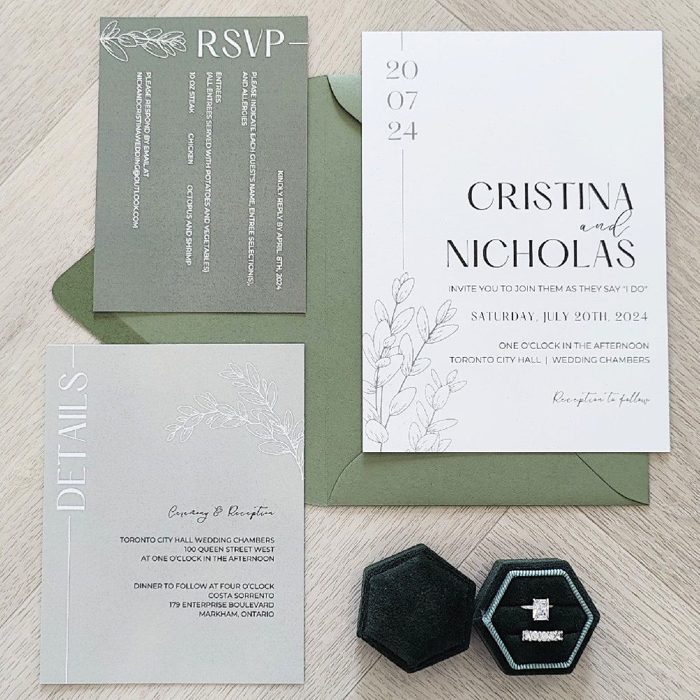 This is a complete set of an invitation suite that has the main card along with a RSVP card and details card.  The main card is printed on a simple matte white paper.  The RSVP and Details inserts have a solid green shade background print to compliment each other.  Everything goes into a matching green envelope.
This wedding took place at the Toronto City Hall.
Toronto City Hall is one of the most popular places in the city for couples looking for a stylish yet affordable civil wedding ceremony.  The wedding chambers are on the 3rd floor of Toronto City Hall, 100 Queen Street West.  Each wedding chamber holds about 15–20 guests, making it perfect for intimate gatherings.  The rooms are modern and bright, with large windows overlooking Nathan Phillips Square.  Licensed City of Toronto marriage officiants perform the ceremony, which typically lasts around 20 minutes.  Ceremonies are offered Monday through Saturday, with time slots that can be booked online. Saturdays fill up quickly, so reserving several months in advance is recommended. This is a complete set of an invitation suite that has the main card along with a RSVP card and details card.  The main card is printed on a simple matte white paper.  The RSVP and Details inserts have a solid green shade background print to compliment each other.  Everything goes into a matching green envelope.
This wedding took place at the Toronto City Hall.
Toronto City Hall is one of the most popular places in the city for couples looking for a stylish yet affordable civil wedding ceremony.  The wedding chambers are on the 3rd floor of Toronto City Hall, 100 Queen Street West.  Each wedding chamber holds about 15–20 guests, making it perfect for intimate gatherings.  The rooms are modern and bright, with large windows overlooking Nathan Phillips Square.  Licensed City of Toronto marriage officiants perform the ceremony, which typically lasts around 20 minutes.  Ceremonies are offered Monday through Saturday, with time slots that can be booked online. Saturdays fill up quickly, so reserving several months in advance is recommended.