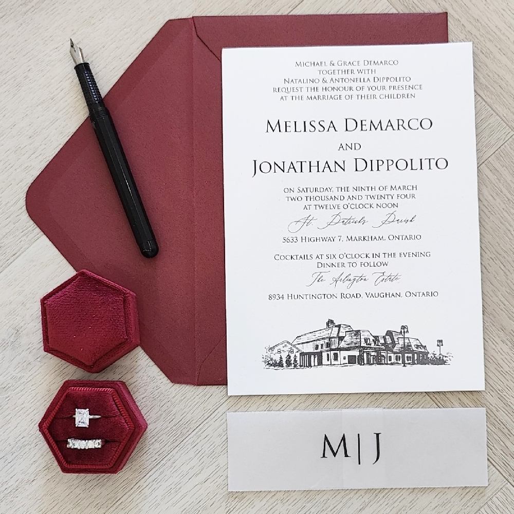 This is a single card wedding invite printed with a flat digital black ink.  There is a venue sketch of the reception building at the bottom of the layout.  Along with a vellum belly band that has the couples monogram initials.  The invite is paired with a burgundy colored envelope.
This wedding took place at the Arlington Estates in Vaughan, Ontario, Canada.
The Arlington Estate is one of the most sought-after luxury wedding venues in the Greater Toronto Area. Located in Vaughan, just north of Toronto, this private 7-acre estate blends modern elegance with country-estate charm. Couples love its combination of expansive outdoor grounds and stylish indoor spaces, making it ideal for any season. This is a single card wedding invite printed with a flat digital black ink.  There is a venue sketch of the reception building at the bottom of the layout.  Along with a vellum belly band that has the couples monogram initials.  The invite is paired with a burgundy colored envelope.
This wedding took place at the Arlington Estates in Vaughan, Ontario, Canada.
The Arlington Estate is one of the most sought-after luxury wedding venues in the Greater Toronto Area. Located in Vaughan, just north of Toronto, this private 7-acre estate blends modern elegance with country-estate charm. Couples love its combination of expansive outdoor grounds and stylish indoor spaces, making it ideal for any season.