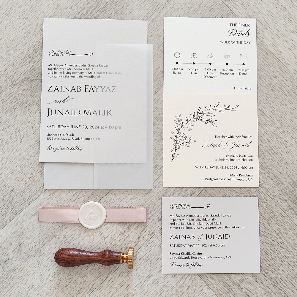 This is a full invitation suite that has a single card wrapped with a full vellum enclosure wrap.  Along with a 5/8 deep blush ribbon with a ivory love wax seal stamp embellishment.  The main card is printed on a stone silver smooth paper.  There are additional inserts that show a timeline of events, additional details and a RSVP card.
This event took place at the Lionhead Golf Club in Mississauga, Ontario, Canada.
Lionhead Golf Club & Conference Centre in Brampton, Ontario, is a very popular venue for weddings in the Greater Toronto Area. It’s well known for its lush golf course views, elegant banquet spaces, and all-in-one convenience for both ceremonies and receptions.  The overall vibe at Lionhead blends classic elegance with natural beauty. It’s especially appealing for couples who want a traditional banquet hall feel but also want outdoor elements like gardens and golf course scenery. This is a full invitation suite that has a single card wrapped with a full vellum enclosure wrap.  Along with a 5/8 deep blush ribbon with a ivory love wax seal stamp embellishment.  The main card is printed on a stone silver smooth paper.  There are additional inserts that show a timeline of events, additional details and a RSVP card.
This event took place at the Lionhead Golf Club in Mississauga, Ontario, Canada.
Lionhead Golf Club & Conference Centre in Brampton, Ontario, is a very popular venue for weddings in the Greater Toronto Area. It’s well known for its lush golf course views, elegant banquet spaces, and all-in-one convenience for both ceremonies and receptions.  The overall vibe at Lionhead blends classic elegance with natural beauty. It’s especially appealing for couples who want a traditional banquet hall feel but also want outdoor elements like gardens and golf course scenery.