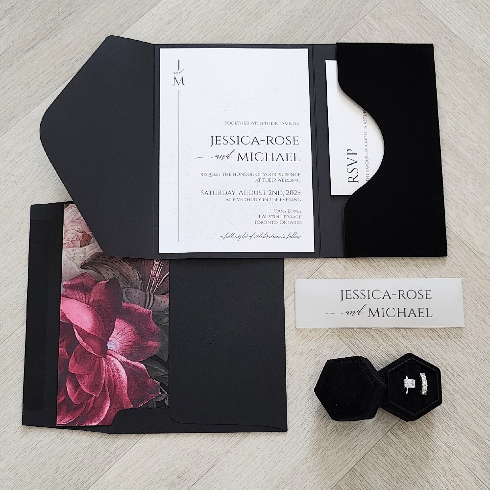 This is a black velvet material trifold pocketfolder wedding invitation.  There is a pocket on the inside right to hold extra inserts like RSVP cards and more.  There is a vellum belly band that wraps around the invite to keep it closed.  This invitation goes inside a matching black envelope with a floral printed design envelope liner.
This romantic wedding took place at the famous Casa Loma in Toronto, Ontario, Canada.
A wedding at Casa Loma is truly like stepping into a fairy tale. This historic Gothic Revival castle in the heart of Toronto offers a breathtaking backdrop with its soaring ceilings, grand architecture, and romantic candlelit ambiance. Couples can exchange vows in the lush outdoor gardens surrounded by seasonal blooms and fountains, or opt for one of the elegant indoor spaces such as the Conservatory with its stained-glass dome, the wood-paneled Library, or the majestic Great Hall. Receptions are equally enchanting, with the ability to host intimate gatherings or grand celebrations of up to 200 guests. With catering exclusively provided by Liberty Entertainment Group, menus are customizable and paired with refined service to match the regal setting. Offering both timeless elegance and dramatic photo opportunities, Casa Loma remains one of Toronto’s most iconic and sought-after wedding venues. This is a black velvet material trifold pocketfolder wedding invitation.  There is a pocket on the inside right to hold extra inserts like RSVP cards and more.  There is a vellum belly band that wraps around the invite to keep it closed.  This invitation goes inside a matching black envelope with a floral printed design envelope liner.
This romantic wedding took place at the famous Casa Loma in Toronto, Ontario, Canada.
A wedding at Casa Loma is truly like stepping into a fairy tale. This historic Gothic Revival castle in the heart of Toronto offers a breathtaking backdrop with its soaring ceilings, grand architecture, and romantic candlelit ambiance. Couples can exchange vows in the lush outdoor gardens surrounded by seasonal blooms and fountains, or opt for one of the elegant indoor spaces such as the Conservatory with its stained-glass dome, the wood-paneled Library, or the majestic Great Hall. Receptions are equally enchanting, with the ability to host intimate gatherings or grand celebrations of up to 200 guests. With catering exclusively provided by Liberty Entertainment Group, menus are customizable and paired with refined service to match the regal setting. Offering both timeless elegance and dramatic photo opportunities, Casa Loma remains one of Toronto’s most iconic and sought-after wedding venues.