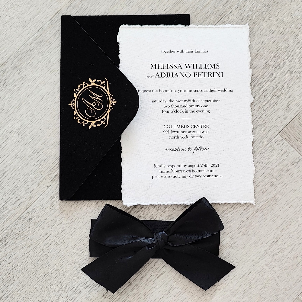 This is a vintage deckle edge wedding invitation printed on a premium white cotton paper.  There is a 1.5 inch black satin bow tied around the invite.  Along with a luxurious black velvet envelope that has the monogram printed with a gold foil press process.
This wedding took place at the Columbus Centre in North York, Toronto, Canada.
The Columbus Centre in Toronto is a stylish and culturally rich venue perfect for couples looking to celebrate their wedding in an elegant and versatile space. Located in the heart of midtown Toronto, this Italian-inspired facility combines modern sophistication with old-world charm. The venue features beautifully designed banquet halls, including the Da Vinci Banquet Hall and Sala Caboto Ballroom, which can accommodate both intimate gatherings and grand receptions. Each space is adorned with classic décor, warm lighting, and flexible layouts that can be customized to match your wedding theme.
Couples hosting their wedding at the Columbus Centre can take advantage of full-service event planning, gourmet Italian catering, and professional staff who ensure every detail runs smoothly. The on-site culinary team is renowned for their authentic Italian dishes and beautifully presented menus, offering options for both plated dinners and buffets. Guests will also enjoy the convenience of ample parking and a central location close to downtown Toronto. With its combination of culture, cuisine, and contemporary elegance, the Columbus Centre offers a perfect setting for couples who want a memorable and stress-free wedding experience. This is a vintage deckle edge wedding invitation printed on a premium white cotton paper.  There is a 1.5 inch black satin bow tied around the invite.  Along with a luxurious black velvet envelope that has the monogram printed with a gold foil press process.
This wedding took place at the Columbus Centre in North York, Toronto, Canada.
The Columbus Centre in Toronto is a stylish and culturally rich venue perfect for couples looking to celebrate their wedding in an elegant and versatile space. Located in the heart of midtown Toronto, this Italian-inspired facility combines modern sophistication with old-world charm. The venue features beautifully designed banquet halls, including the Da Vinci Banquet Hall and Sala Caboto Ballroom, which can accommodate both intimate gatherings and grand receptions. Each space is adorned with classic décor, warm lighting, and flexible layouts that can be customized to match your wedding theme.
Couples hosting their wedding at the Columbus Centre can take advantage of full-service event planning, gourmet Italian catering, and professional staff who ensure every detail runs smoothly. The on-site culinary team is renowned for their authentic Italian dishes and beautifully presented menus, offering options for both plated dinners and buffets. Guests will also enjoy the convenience of ample parking and a central location close to downtown Toronto. With its combination of culture, cuisine, and contemporary elegance, the Columbus Centre offers a perfect setting for couples who want a memorable and stress-free wedding experience.